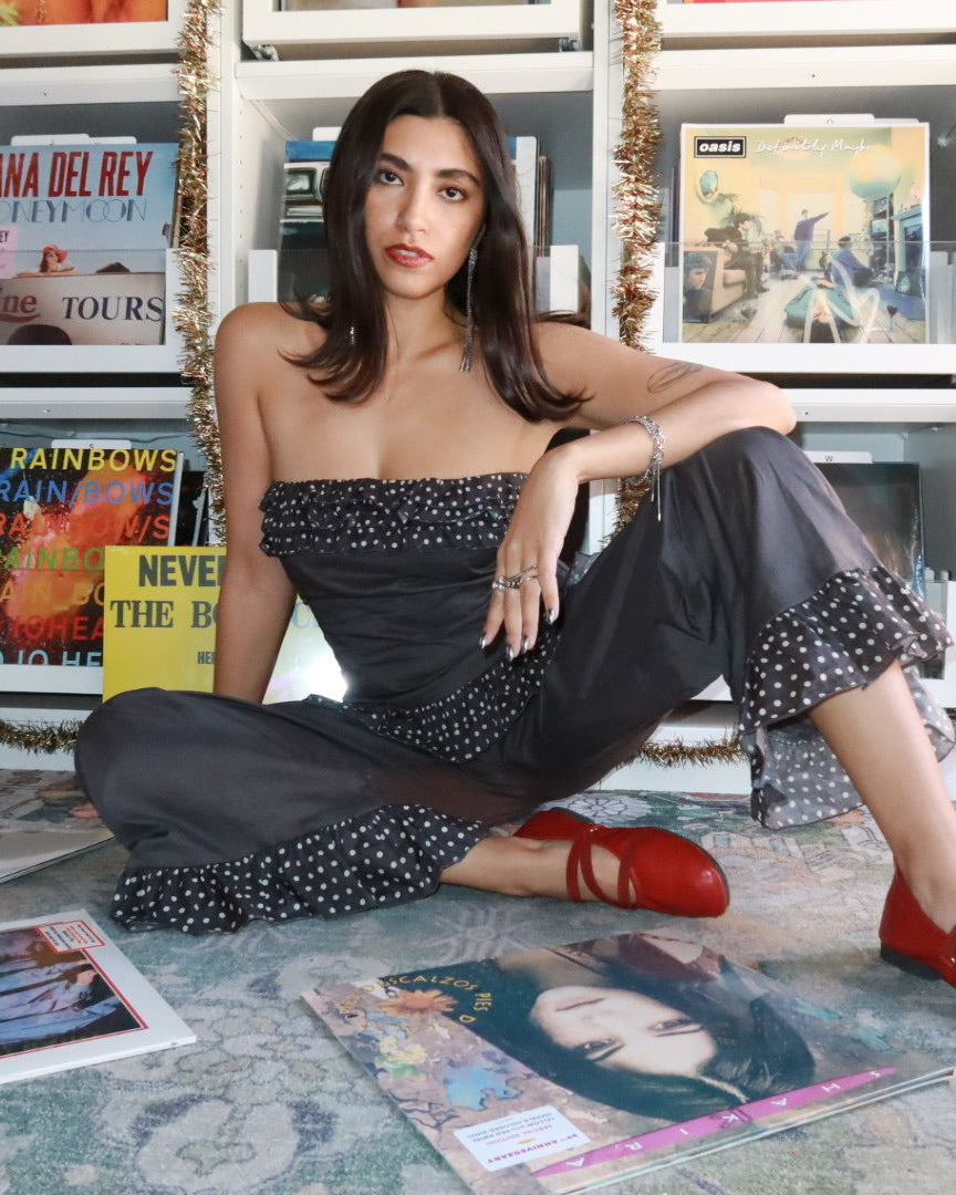 Māre Carmen Says polka dot pants featuring a relaxed fit and elastic waistband, showcased on a model against a plain background.
