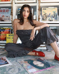 Māre Carmen Says polka dot pants featuring a relaxed fit and elastic waistband, showcased on a model against a plain background.