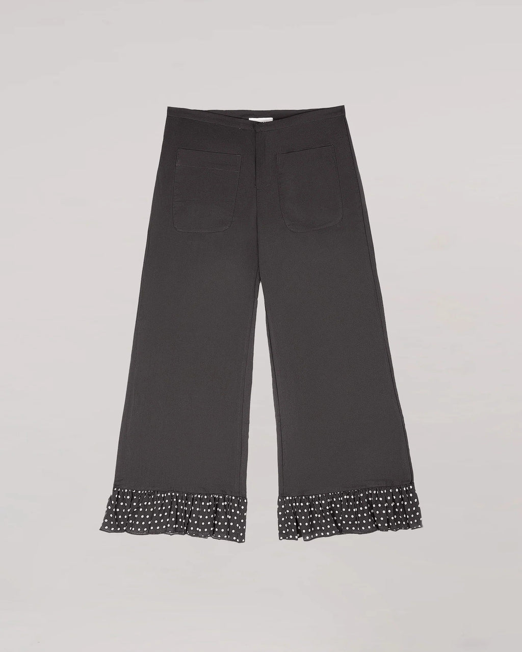 Māre Carmen Says brown polka dot pants with a relaxed fit, featuring a stylish pattern on lightweight fabric.