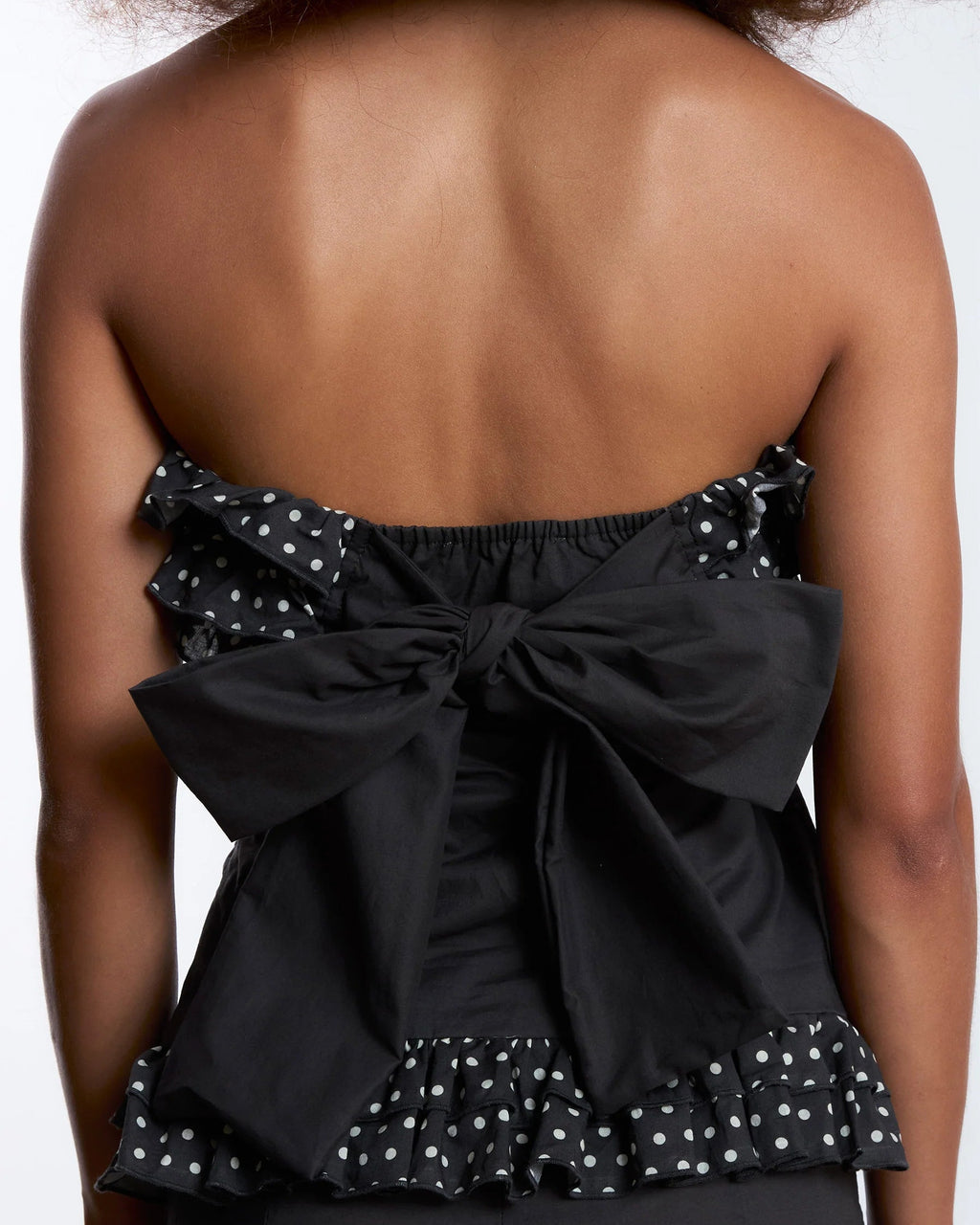 Brown polka dot top by Carmen Says in night noctis style, featuring a stylish casual design for women.