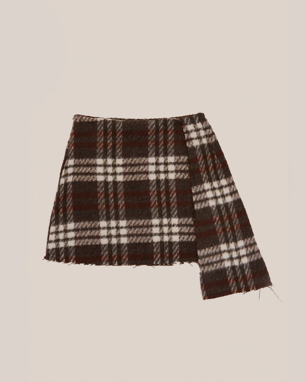 Brown plaid mini skirt by māre, featuring a stylish short design and classic pattern, shown on a model.