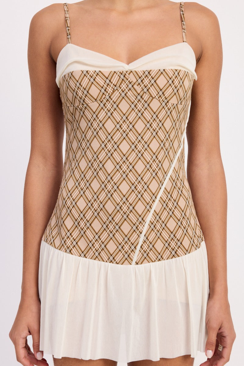 Brown plaid mini dress by māre featuring a stylish, fitted silhouette and classic plaid pattern on lightweight fabric.
