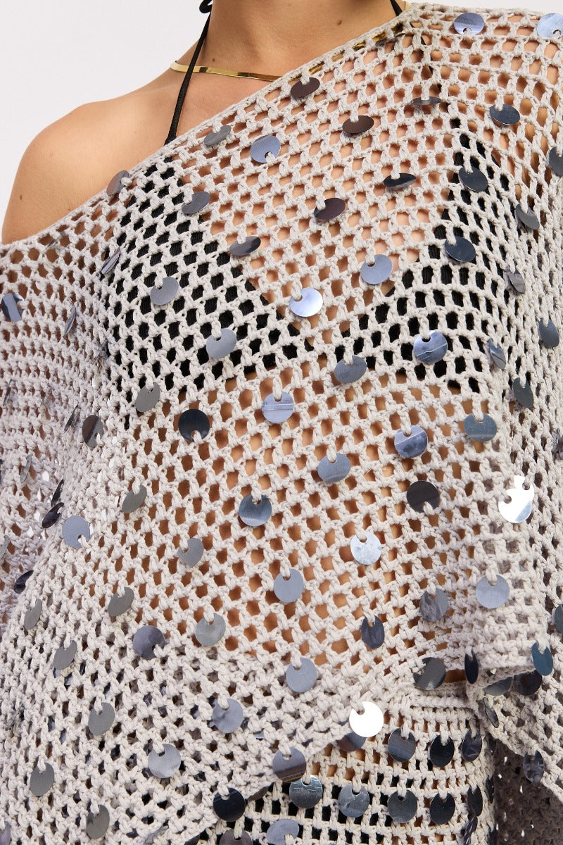 Pale blue silver poncho top by māre featuring a loose fit and draped fabric, styled as casual women's fashion.